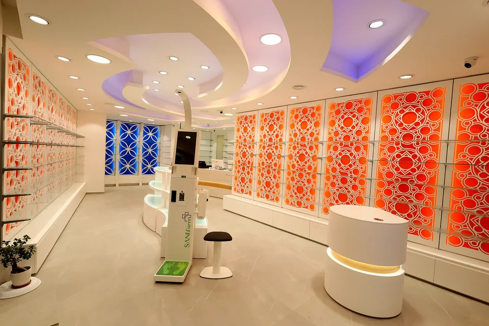 Pharmacy interior with orange partitions and curved ceiling
