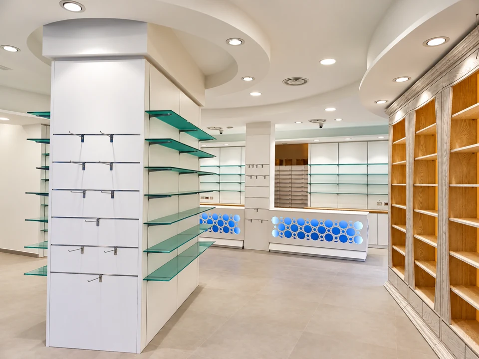 White counter with central glass shelving and diffused lighting
