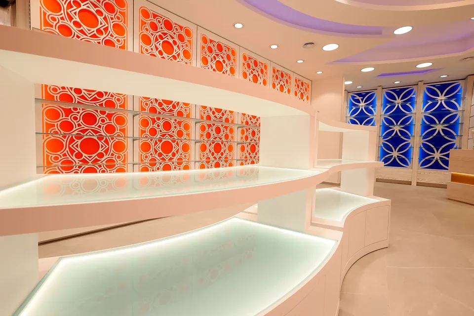White counter in front of an orange backlit wall