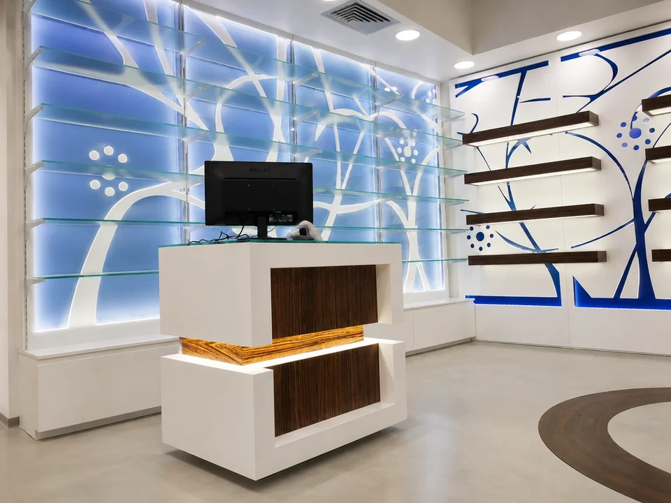 Compact white and wood counter against an illuminated blue backdrop