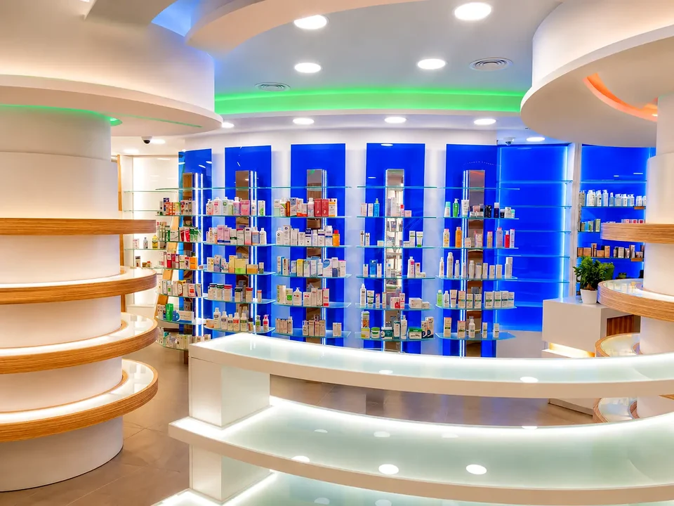 Curved counter and shelving with blue and green lighting