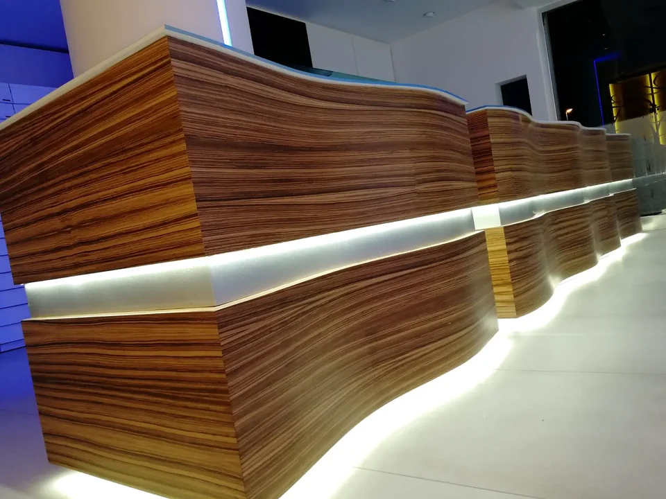 Layered timber counter with illuminated band