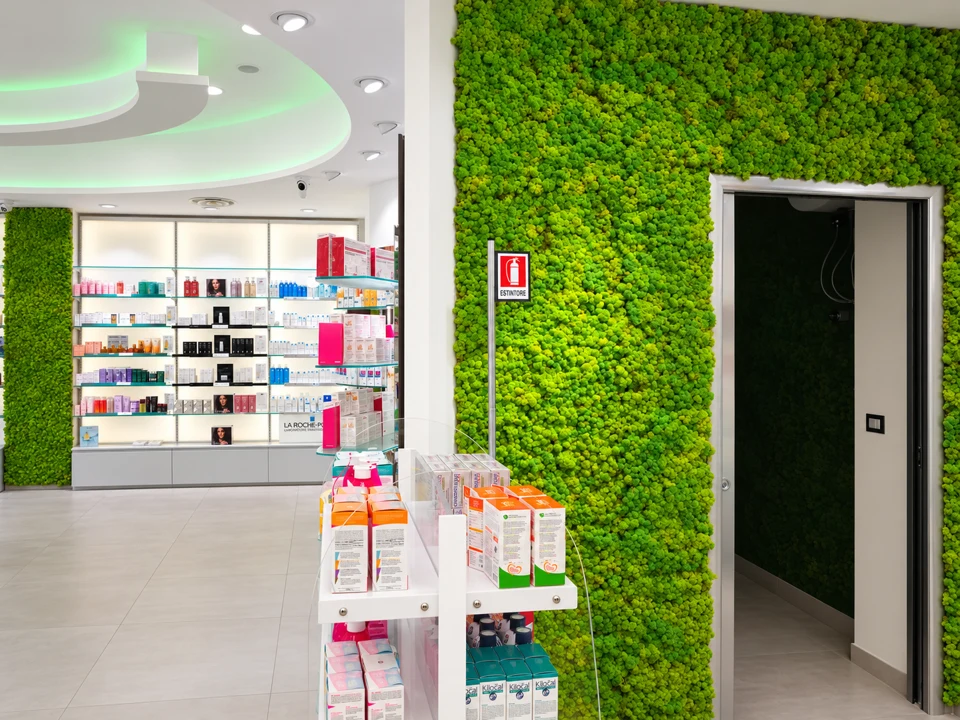 Integrated vertical green wall beside the display area