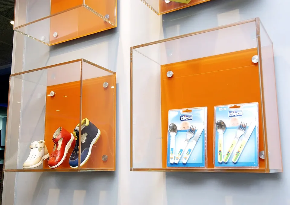 Product display walls beneath a green suspended ceiling