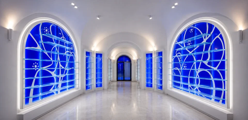 Blue backlit walls with organic motif at OASI Pharmacy