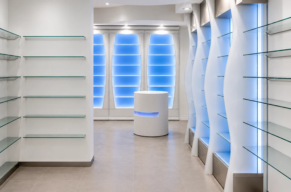 Shaped display walls with pale-blue lighting