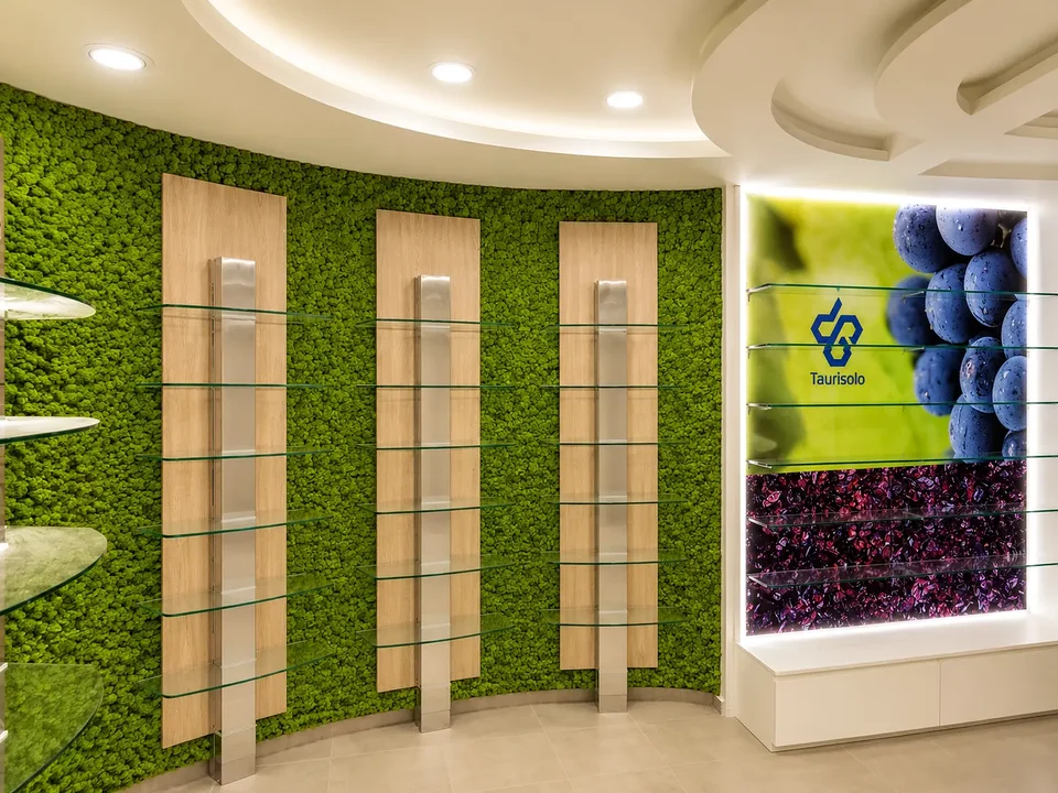 Green walls and illuminated niches in a contemporary pharmacy