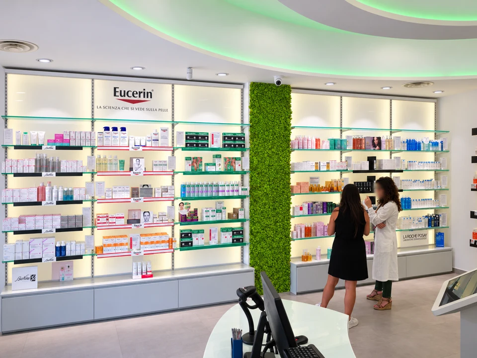 Dermocosmetics department with illuminated walls and customer assistance