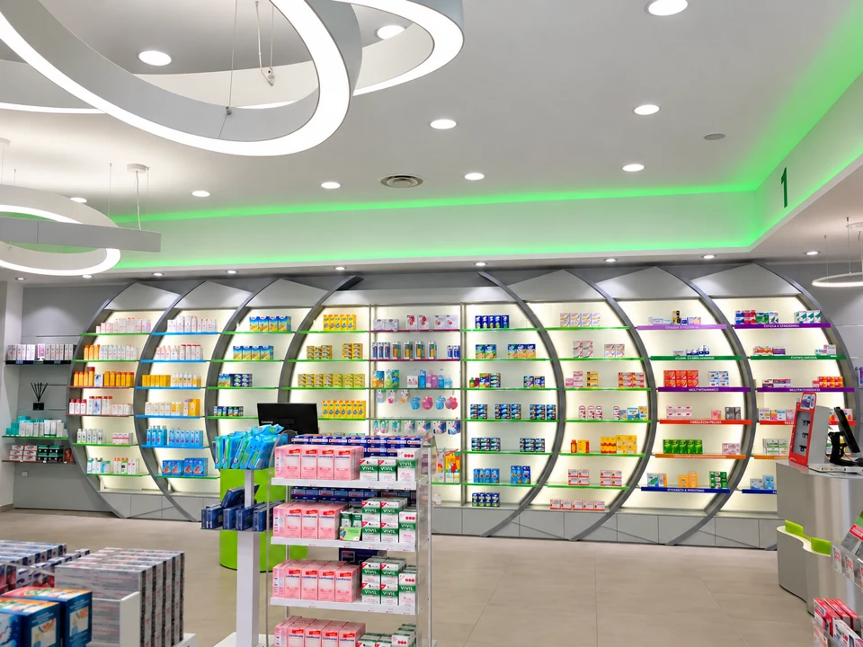 Curved backlit shelving for a product department