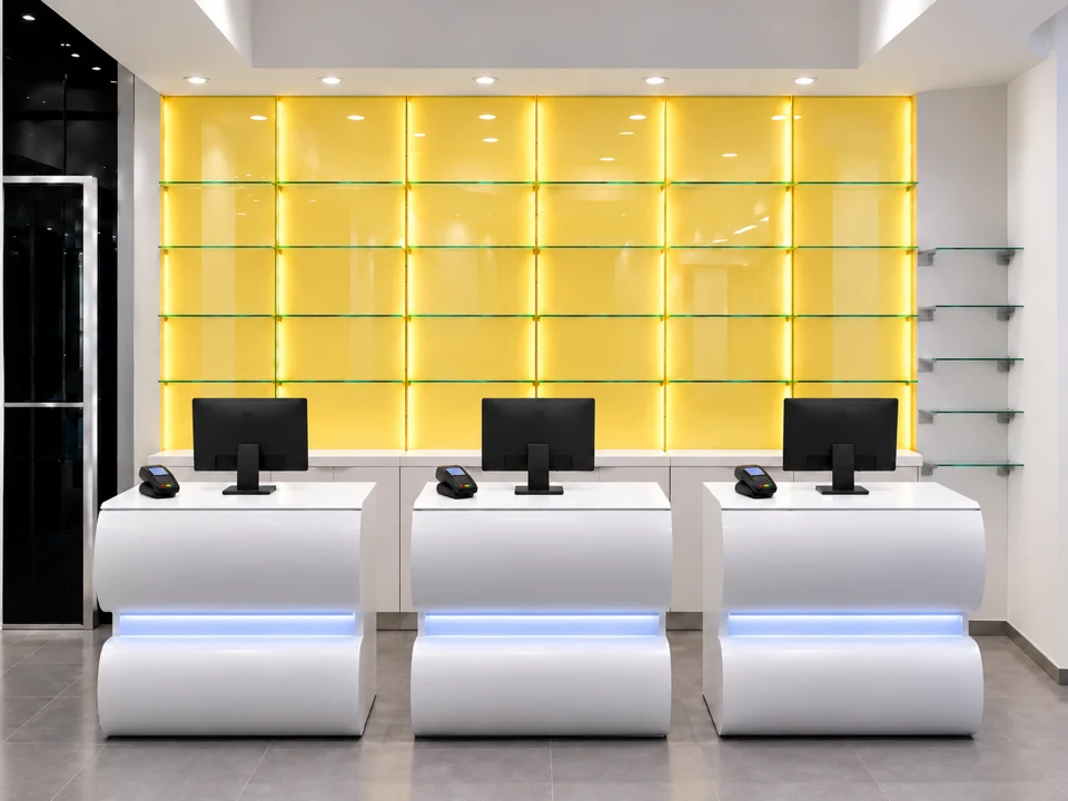 White seating in front of an illuminated display wall