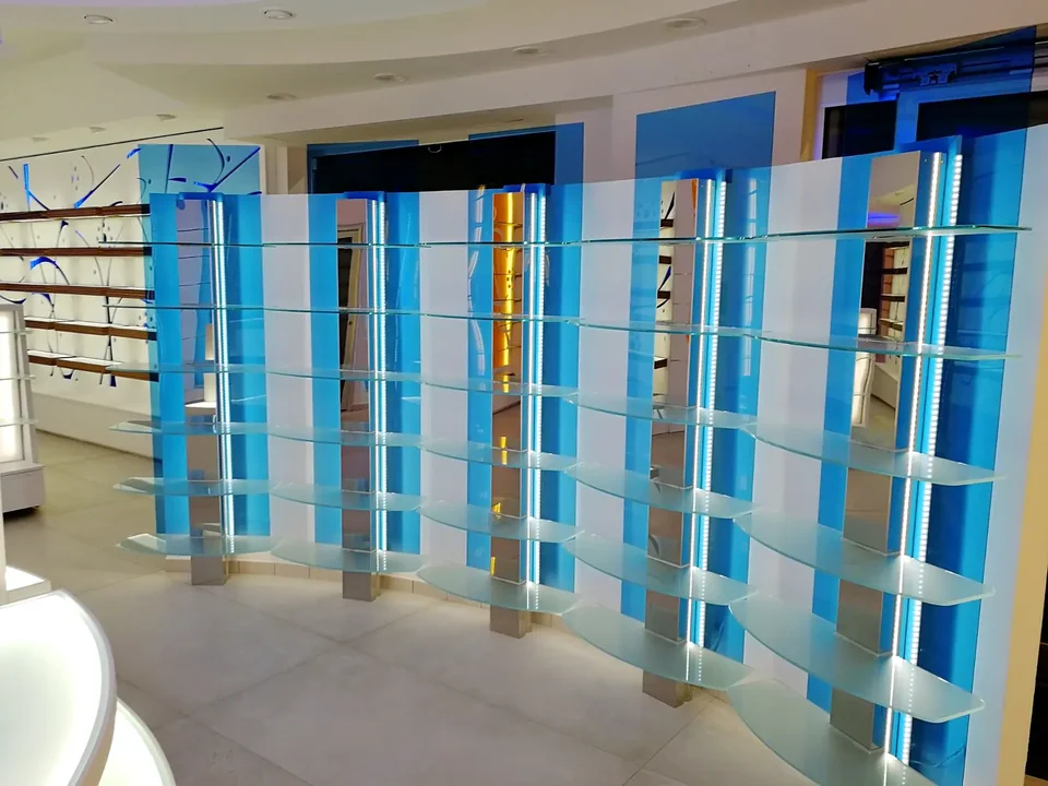Timber and glass display structure with pale-blue lighting
