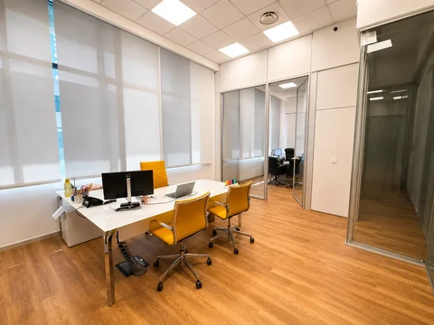 Executive office with glazed partitions at the new Consalvo Servizi headquarters in Rome