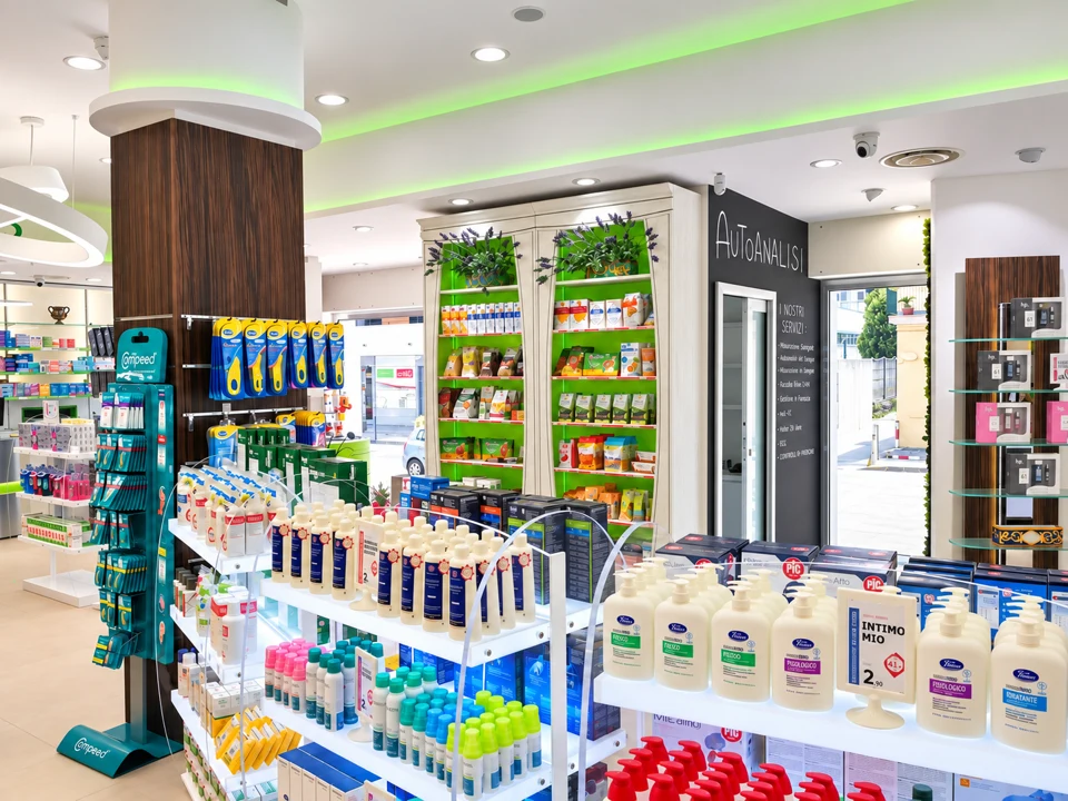 Overall view of the pharmacy with islands and green lighting